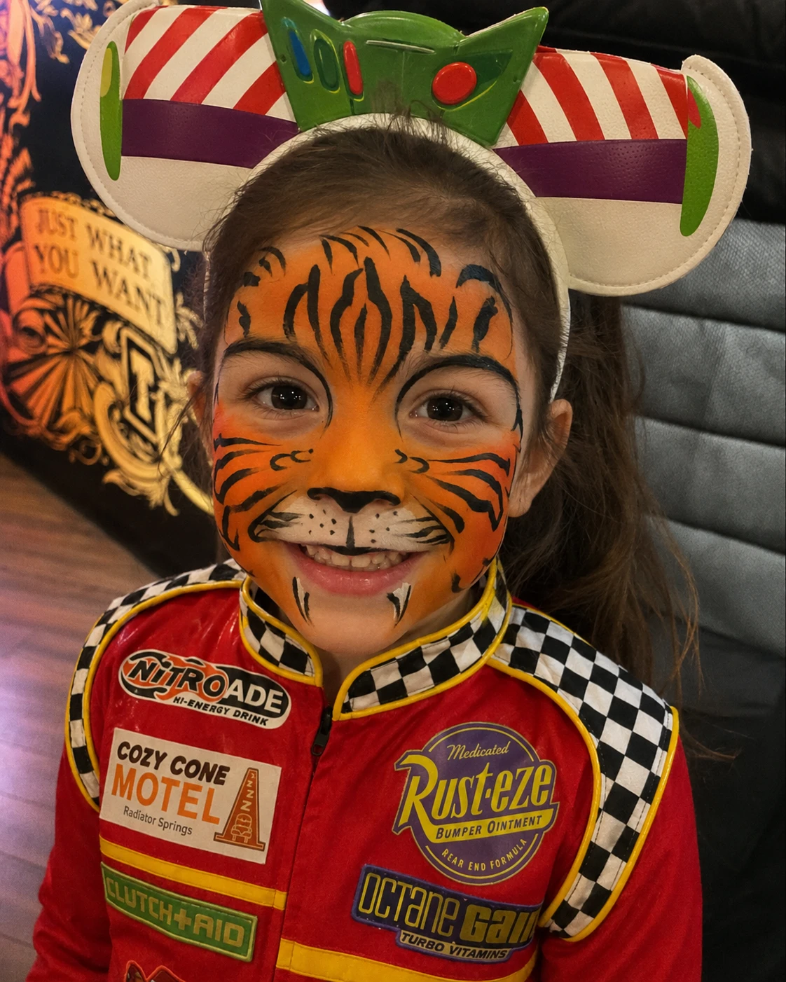 Tiger face paint design on a child at a birthday party
